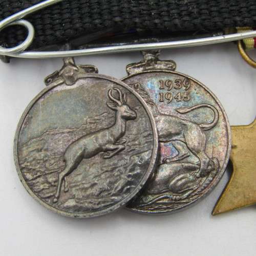 Set of 8 WW2 and SA Police miniature medals with North Africa rossette and commendation leaf
