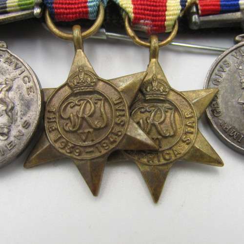Set of 8 WW2 and SA Police miniature medals with North Africa rossette and commendation leaf