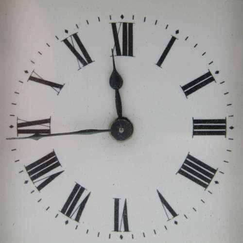 Antique brass carriage clock in original case - runs and stops