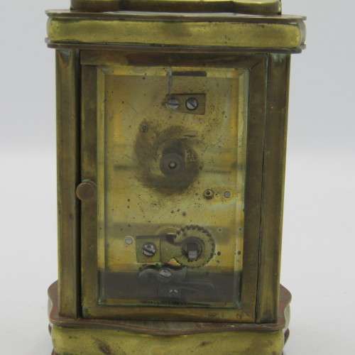 Antique brass carriage clock in original case - runs and stops