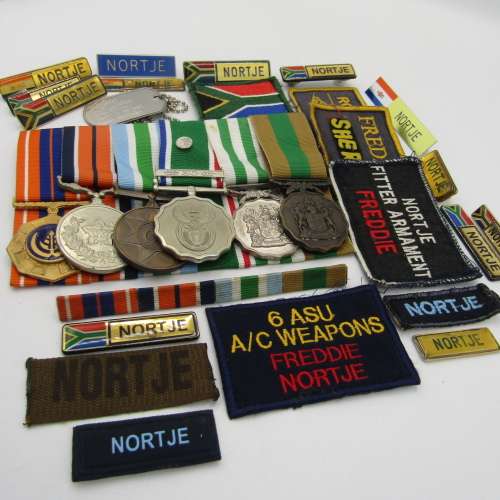 Medal set of SA Air Force Rooivalk and 6 ASU crew member Freddie Nortje plus badges
