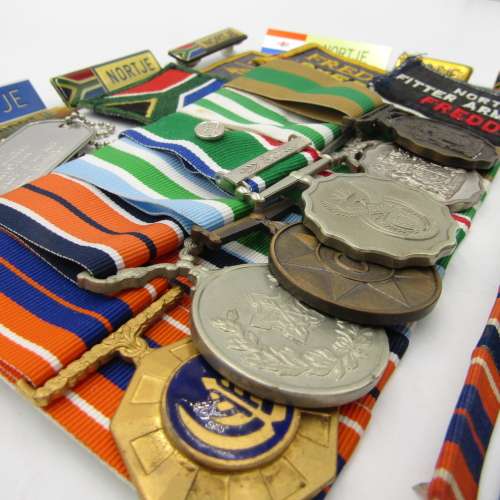 Medal set of SA Air Force Rooivalk and 6 ASU crew member Freddie Nortje plus badges
