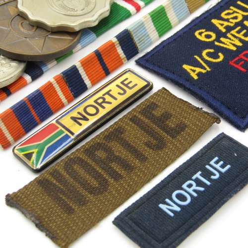 Medal set of SA Air Force Rooivalk and 6 ASU crew member Freddie Nortje plus badges