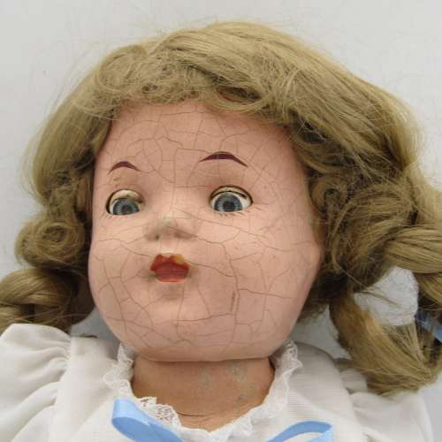 Antique Composition doll with clothing
