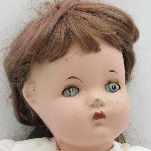 Antique Composition doll with clothing