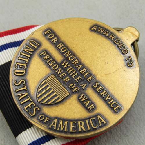 US Prisoner of War honorable service medal and ribbon bars in original box