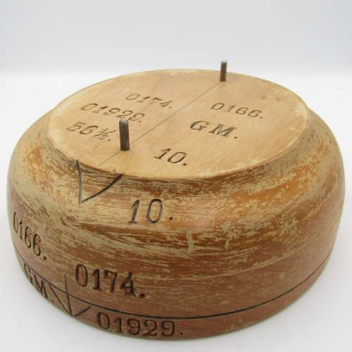 Antique wooden hat form with various markings
