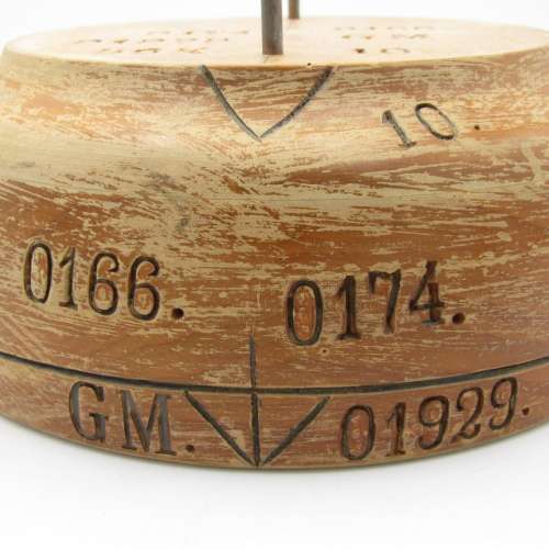 Antique wooden hat form with various markings