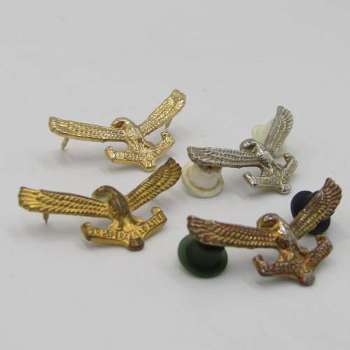 Lot of 4 different colour SA Air Force collar badges