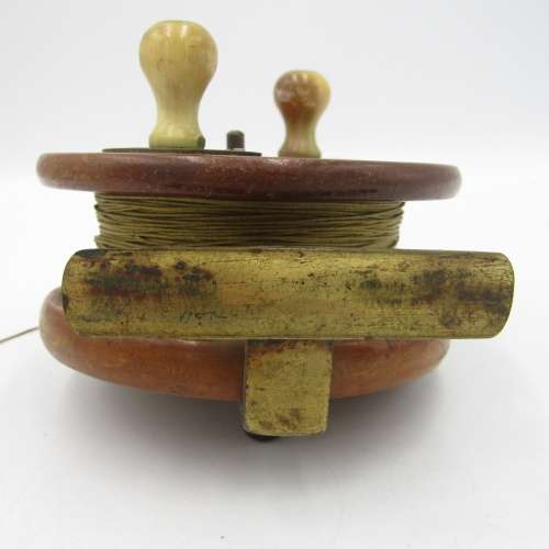 Vintage Wooden fishing reel with bone handles and rachet setting