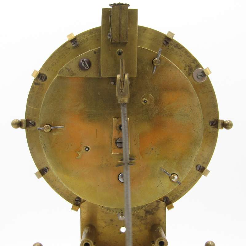Antique brass skeleton clock with glass dome