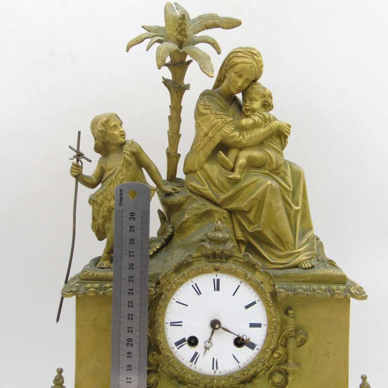 Antique French brass clock with mother and boys under tree