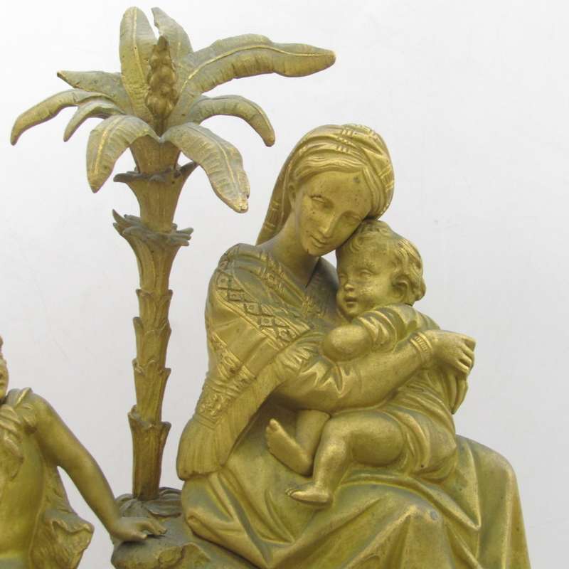 Antique French brass clock with mother and boys under tree