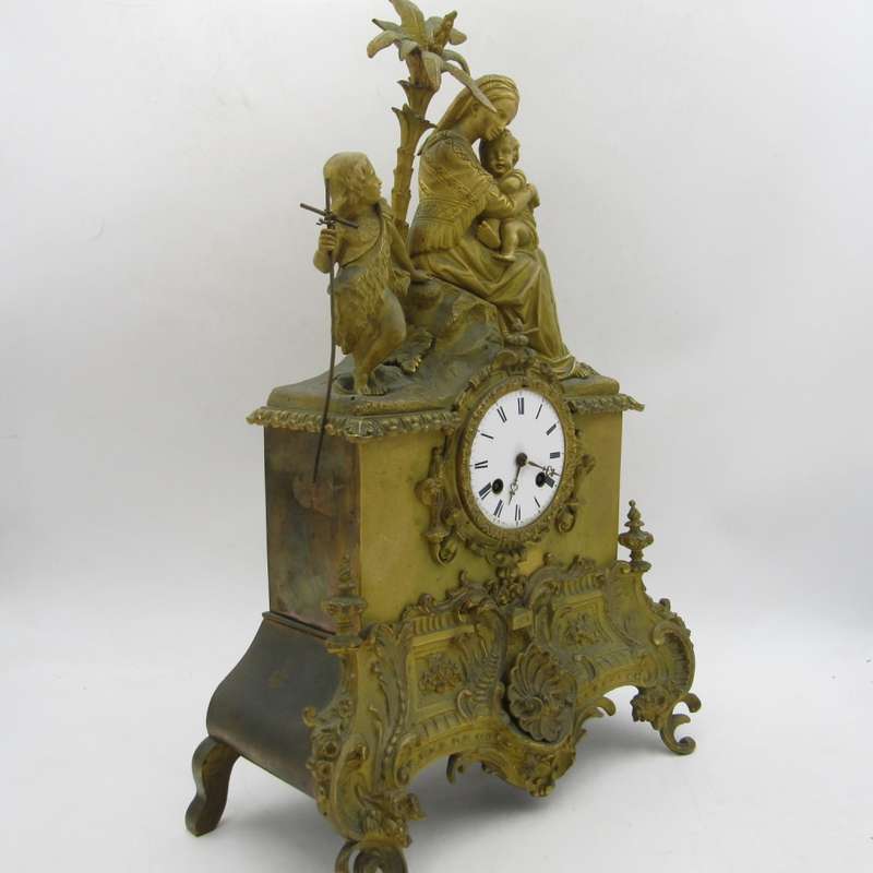 Antique French brass clock with mother and boys under tree