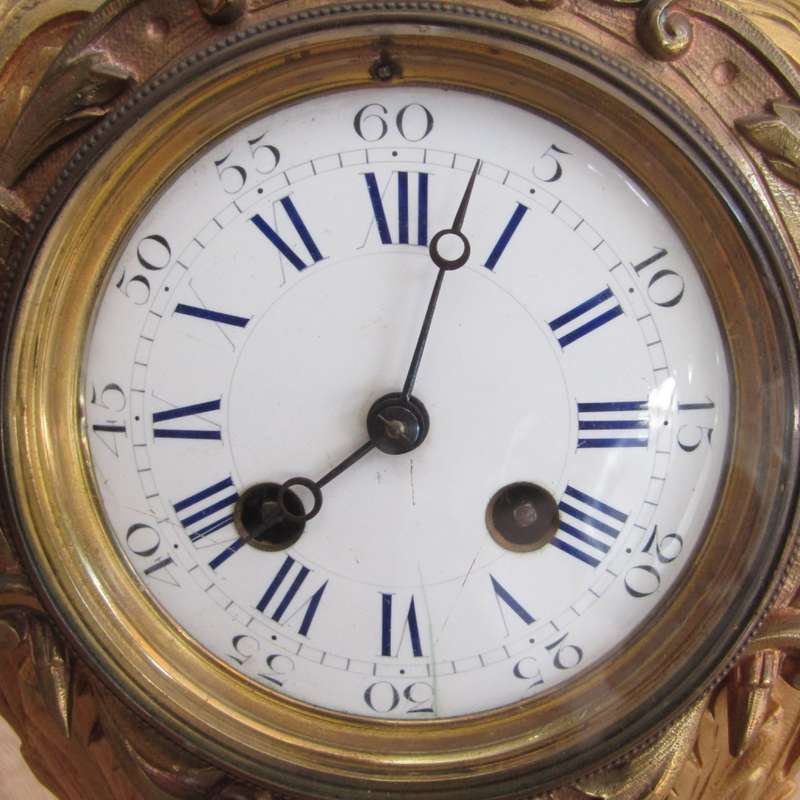 Antique French Ormolu urn clock with stone base