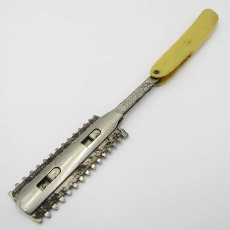Vintage cut throat straight razor with disposable blade