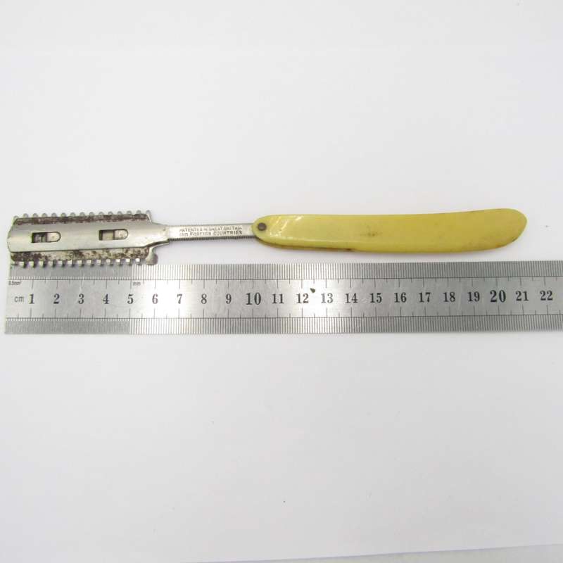 Vintage cut throat straight razor with disposable blade
