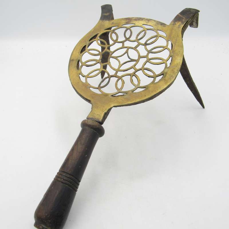Antique brass and cast iron fireside trivet