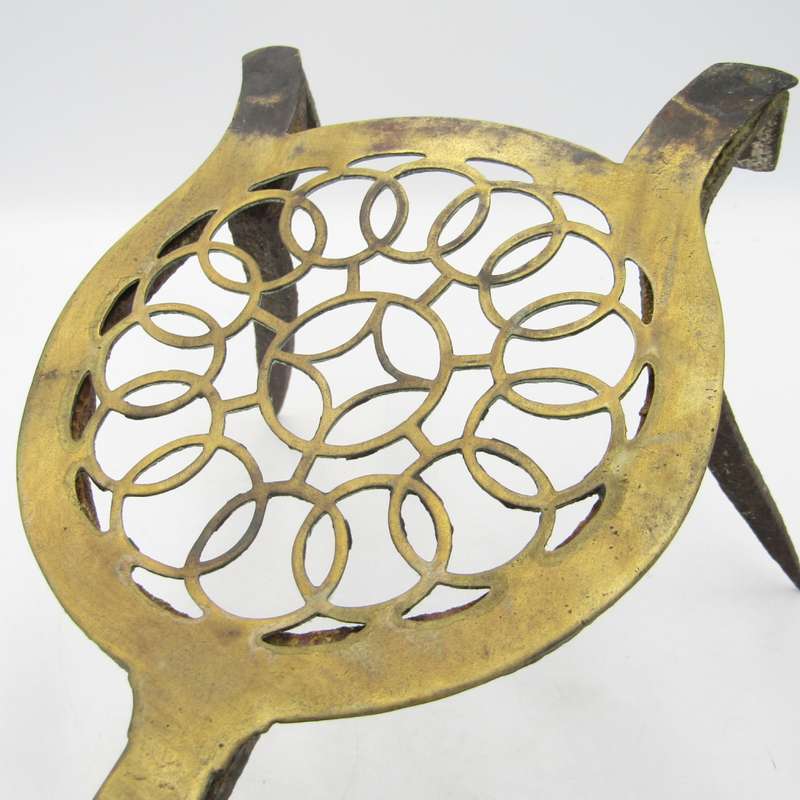 Antique brass and cast iron fireside trivet