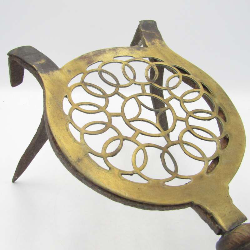 Antique brass and cast iron fireside trivet