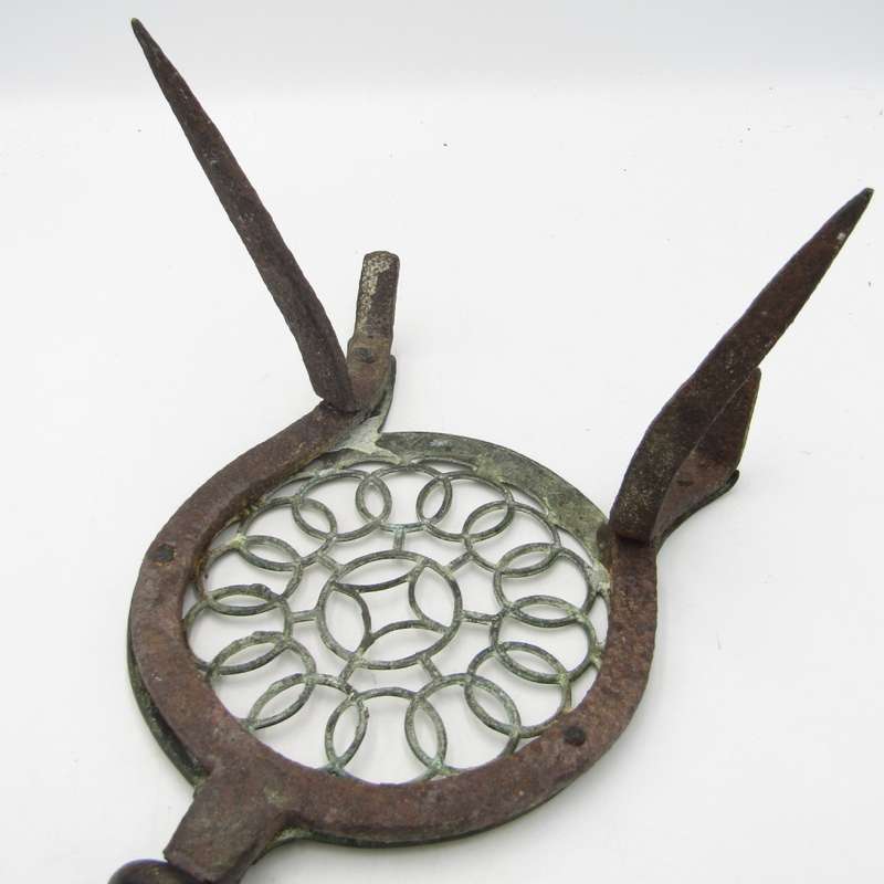 Antique brass and cast iron fireside trivet