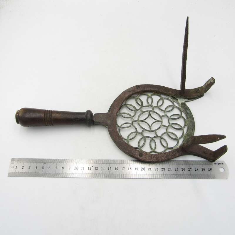 Antique brass and cast iron fireside trivet