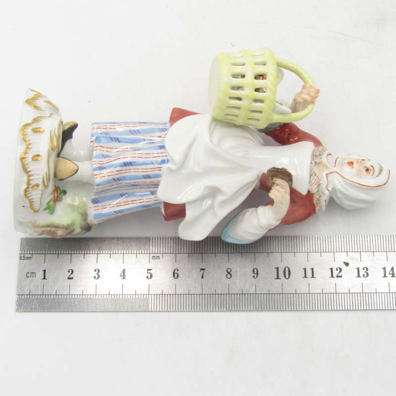 Antique Meissen porcelain figurine of lady with bread basket - small paint chip on bread - 14 cm