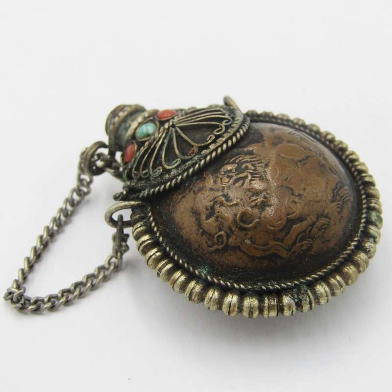 Antique opium bottle with spoon