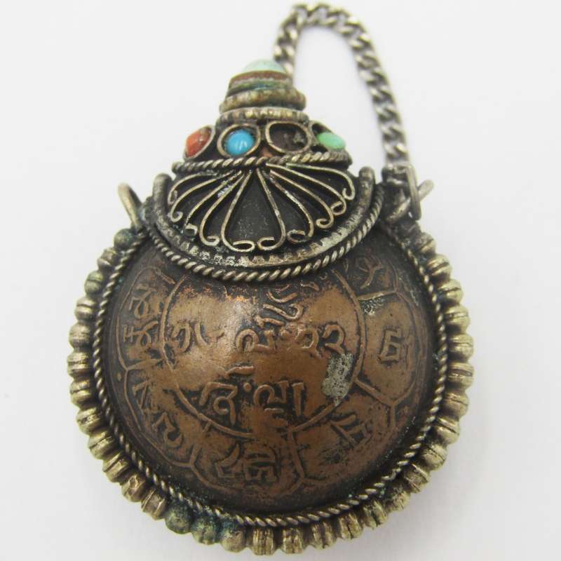 Antique opium bottle with spoon