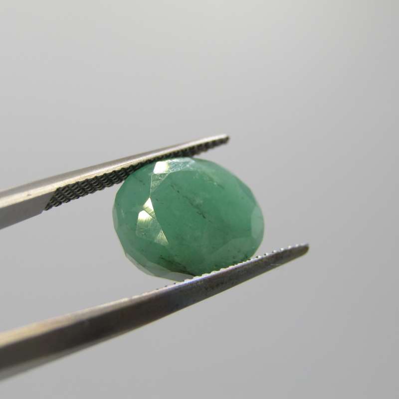 Natural Emerald of 5,22 carat oval mixed cut Medium toned slight bluish green