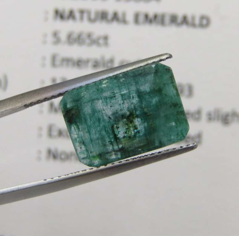 Natural Emerald of 5,66 carat Emerald cut medium dark toned slight bluish green