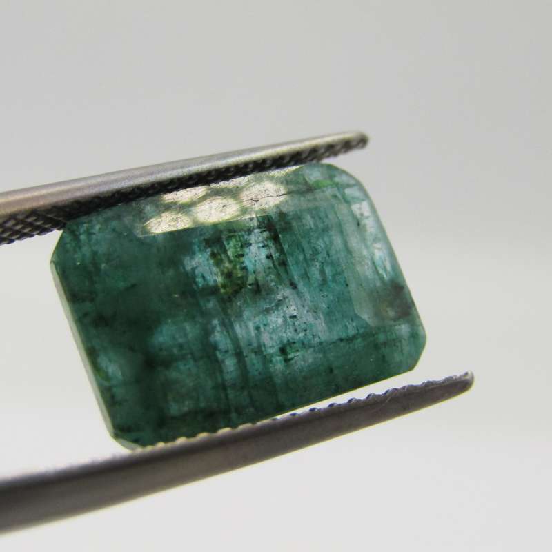 Natural Emerald of 5,66 carat Emerald cut medium dark toned slight bluish green