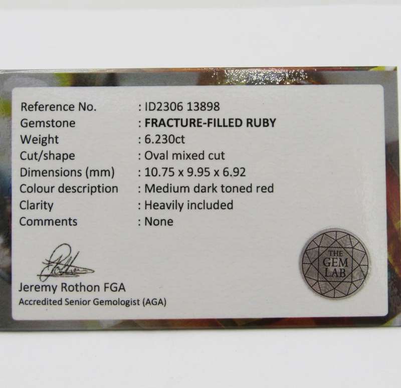 Fracture filled Ruby of 6,2 carat oval mixed cut - dark toned red with Gemlab certificate