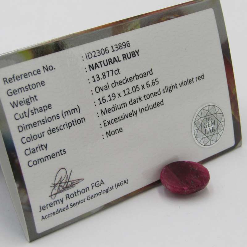 Natural Ruby of 13,8 carat oval checkerboard dark toned slight violet red with Gemlab certificate
