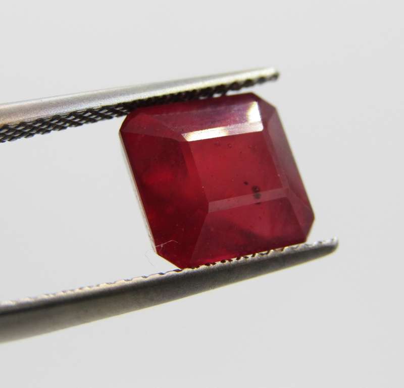Fracture filled Ruby of 5,5 carat medium dark toned red Emerald cut with Gemlab certificate