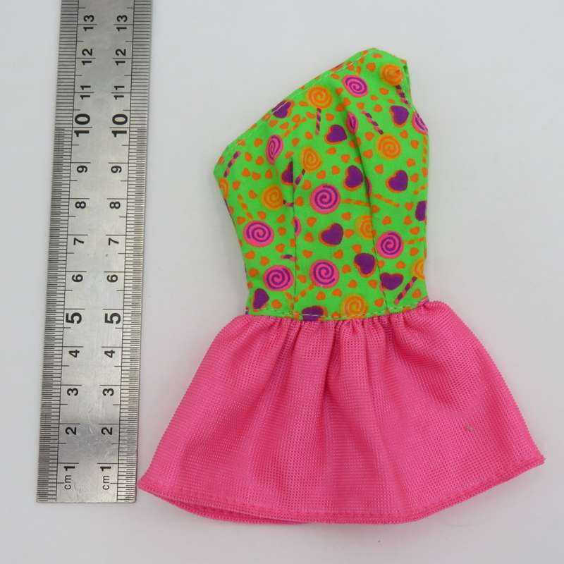 Lot of Barbie doll clothing and accessories