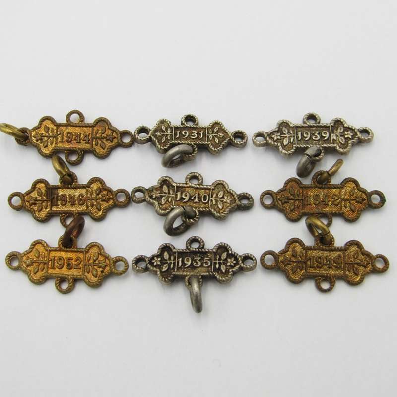 Lot of 9 St John`s Ambulance date labels - some silver