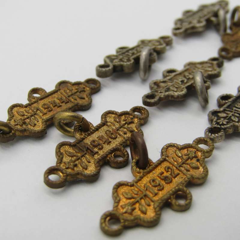 Lot of 9 St John`s Ambulance date labels - some silver
