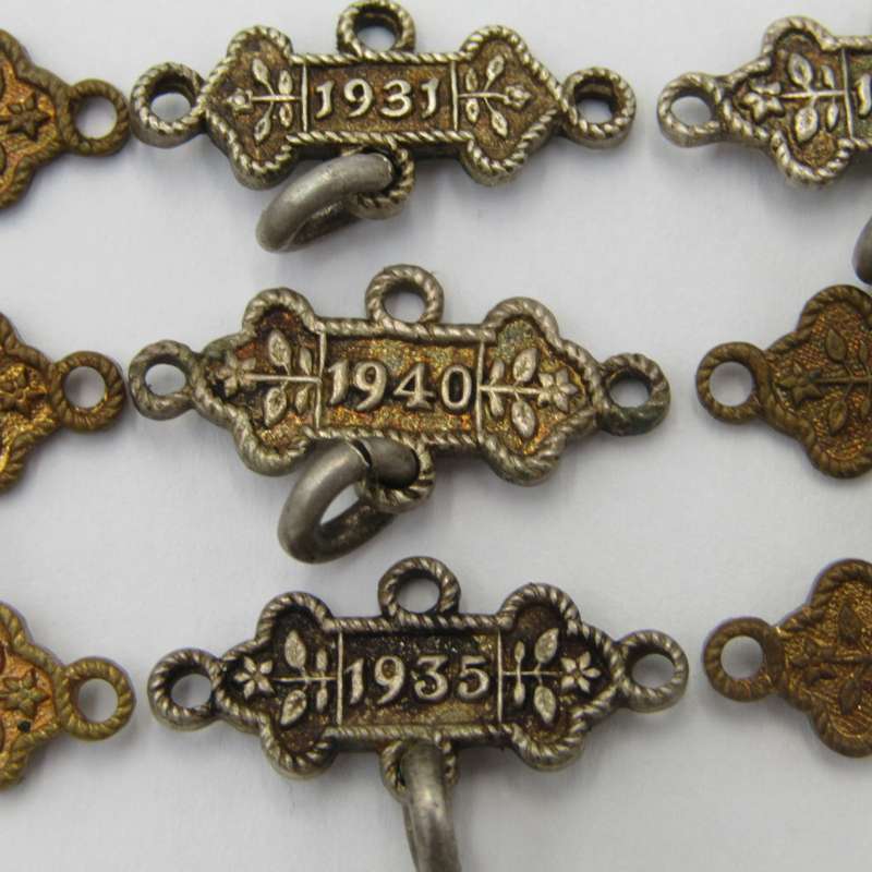 Lot of 9 St John`s Ambulance date labels - some silver