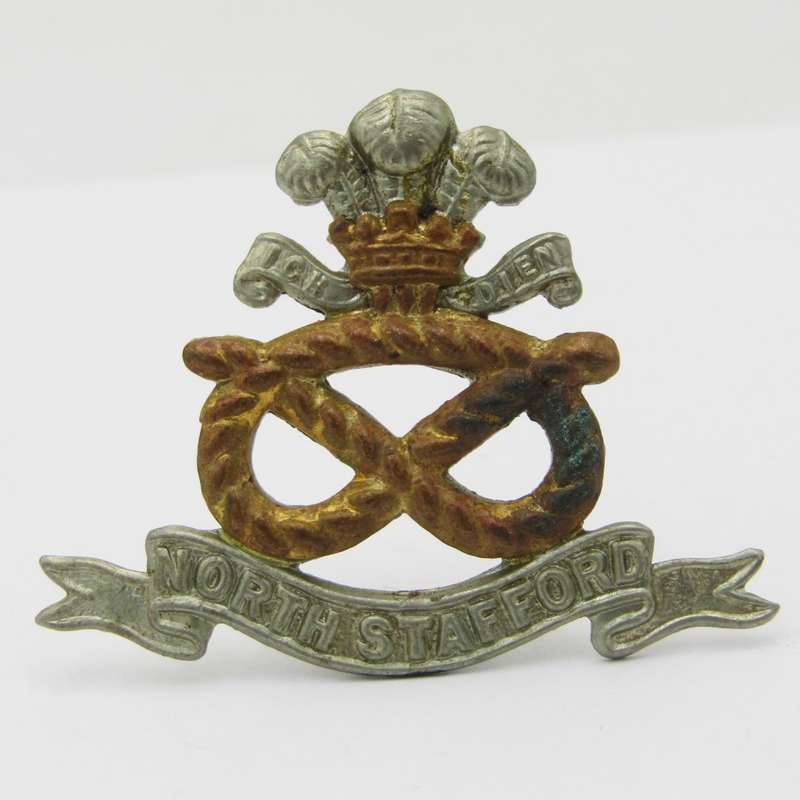 North Staffordshire regiment cap badge with lugs