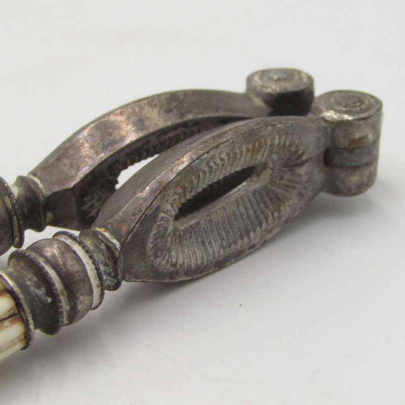 Antique nutcracker with imitation ivory handles