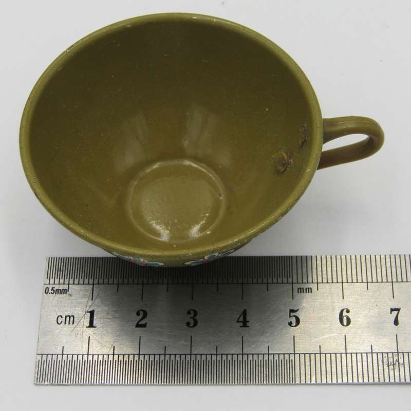 Pair of vintage tinplate doll house cups and saucers