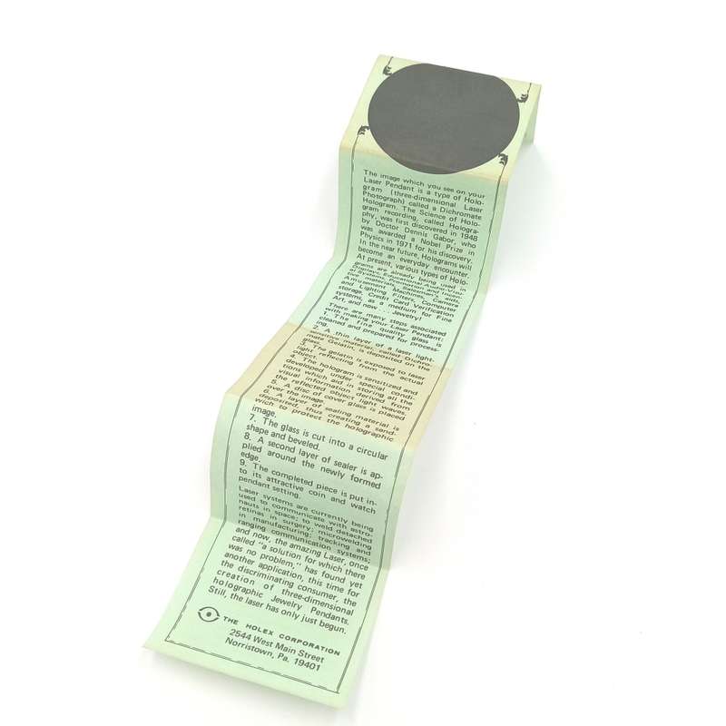 Vintage Hologram pendant with The Laser pendant story