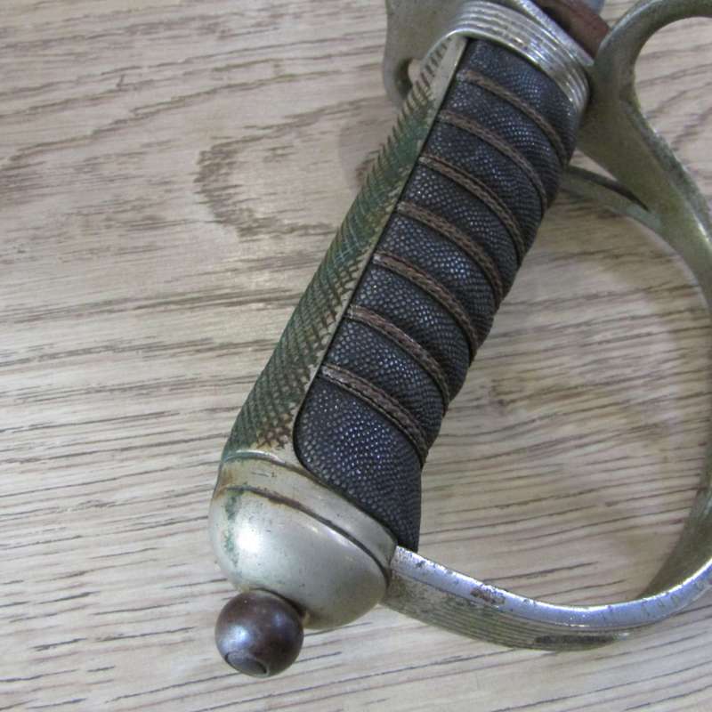 Royal Artillery sword in leather sleeve who belonged to TEJ St Vaughan