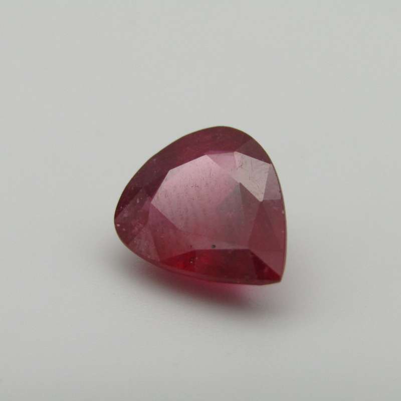 Dark toned slightly purplish red Ruby - fracture filled - 4,92 carat Pear shape