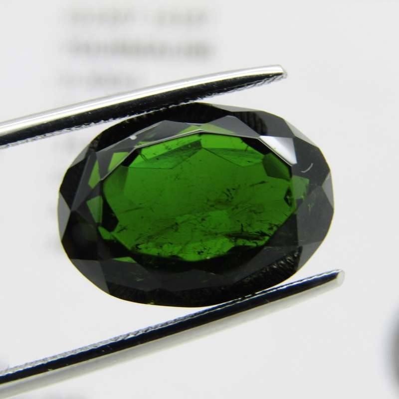 Tourmaline of 9,3 carat - oval mixed cut - dark toned green with Gemlab certificate