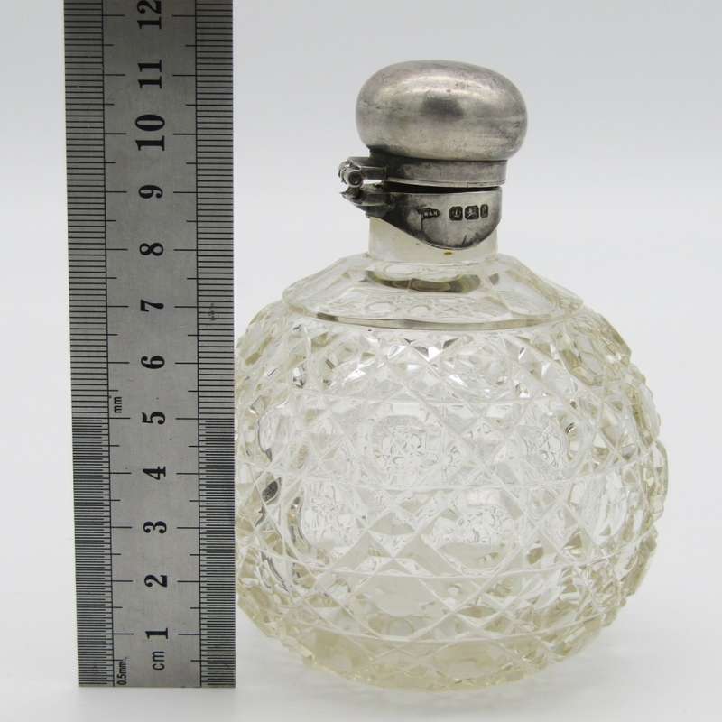 Beautiful glass dressing table bottle with Sterling silver top - lid hinge broken - neck chipped