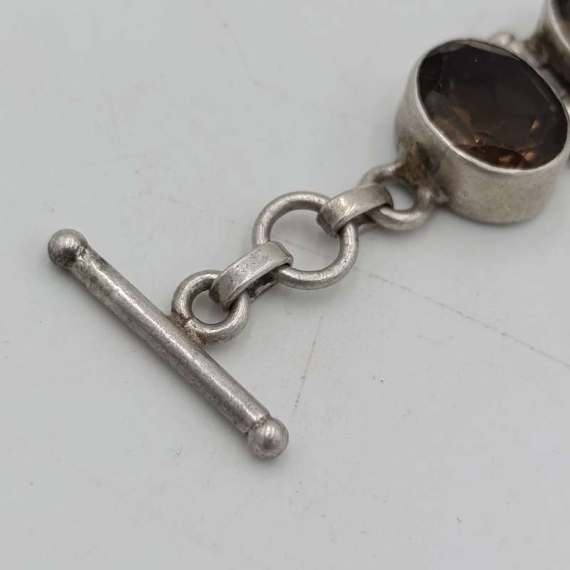 Sterling Silver Agenta bracelet with 12 smokey quarts stones of about 3 carat each - size 19cm long