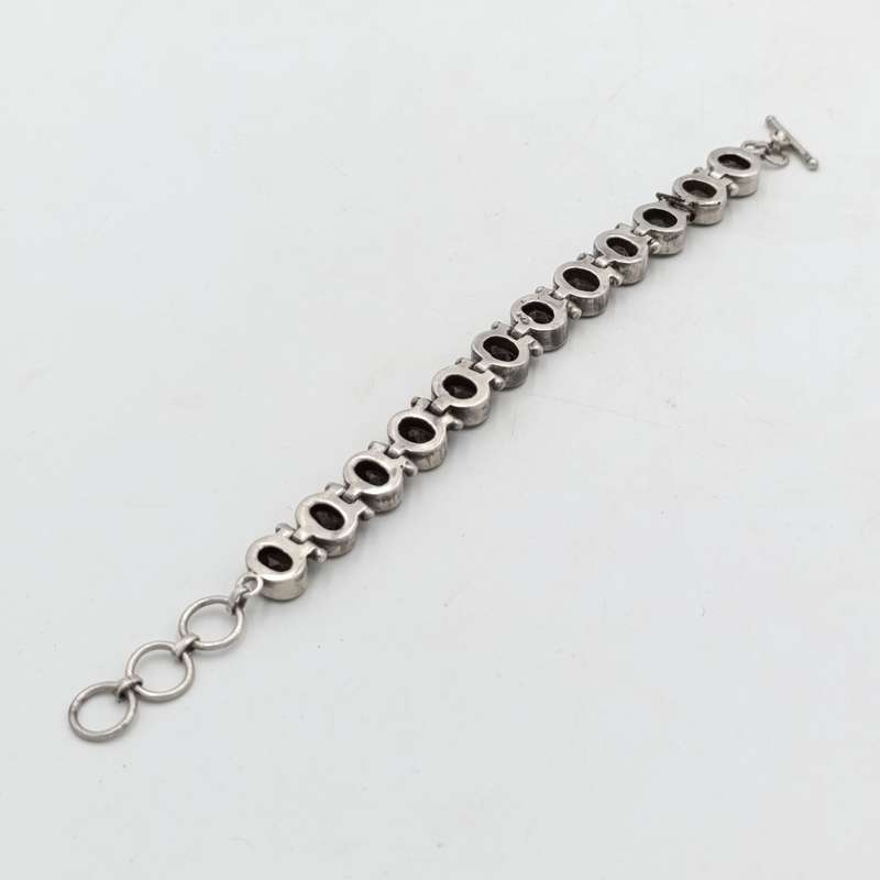 Sterling Silver Agenta bracelet with 12 smokey quarts stones of about 3 carat each - size 19cm long