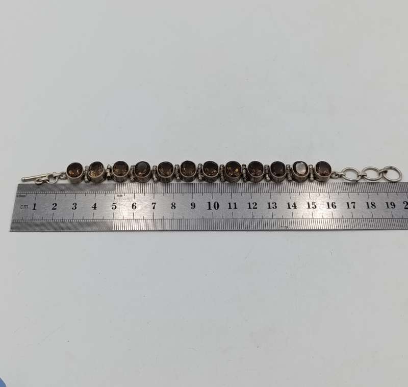 Sterling Silver Agenta bracelet with 12 smokey quarts stones of about 3 carat each - size 19cm long
